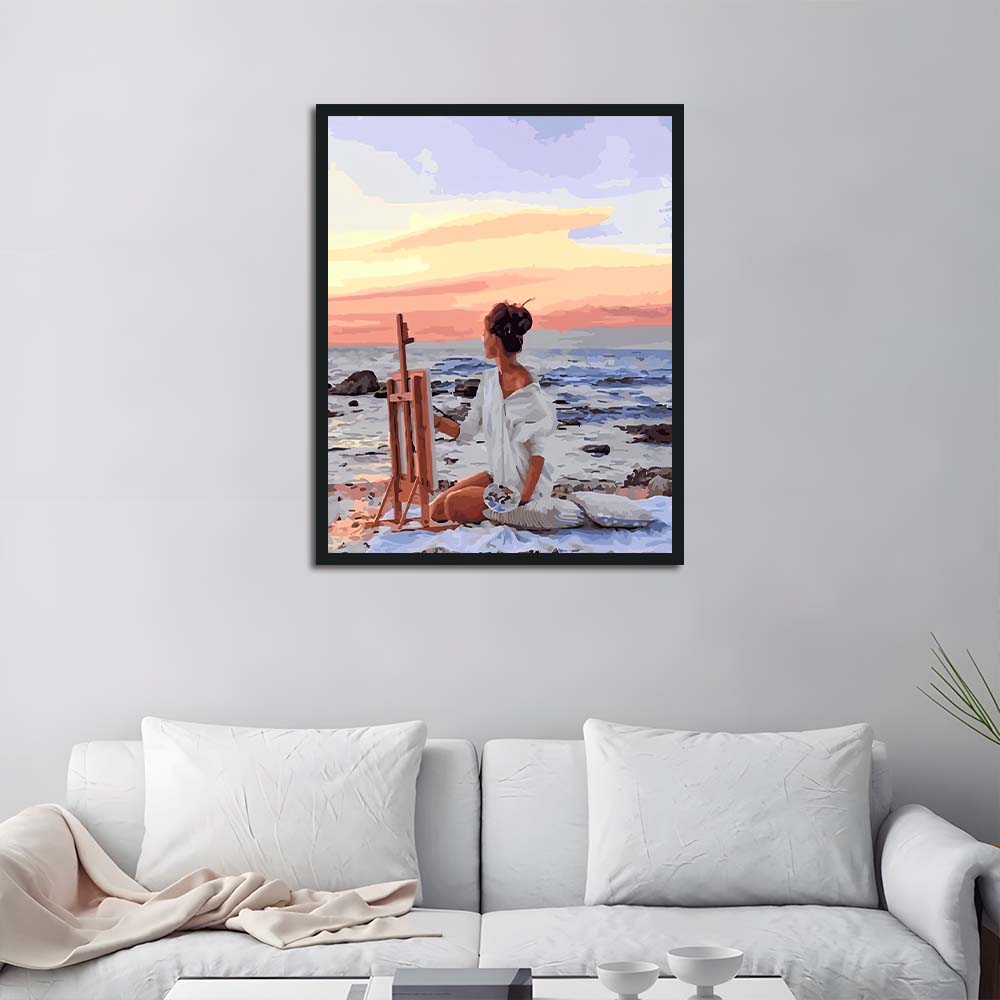 Seated Woman Paints Ocean View Cross Stitch Kits