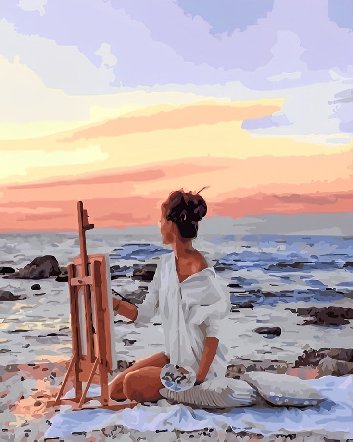 Seated Woman Paints Ocean View Cross Stitch Kits